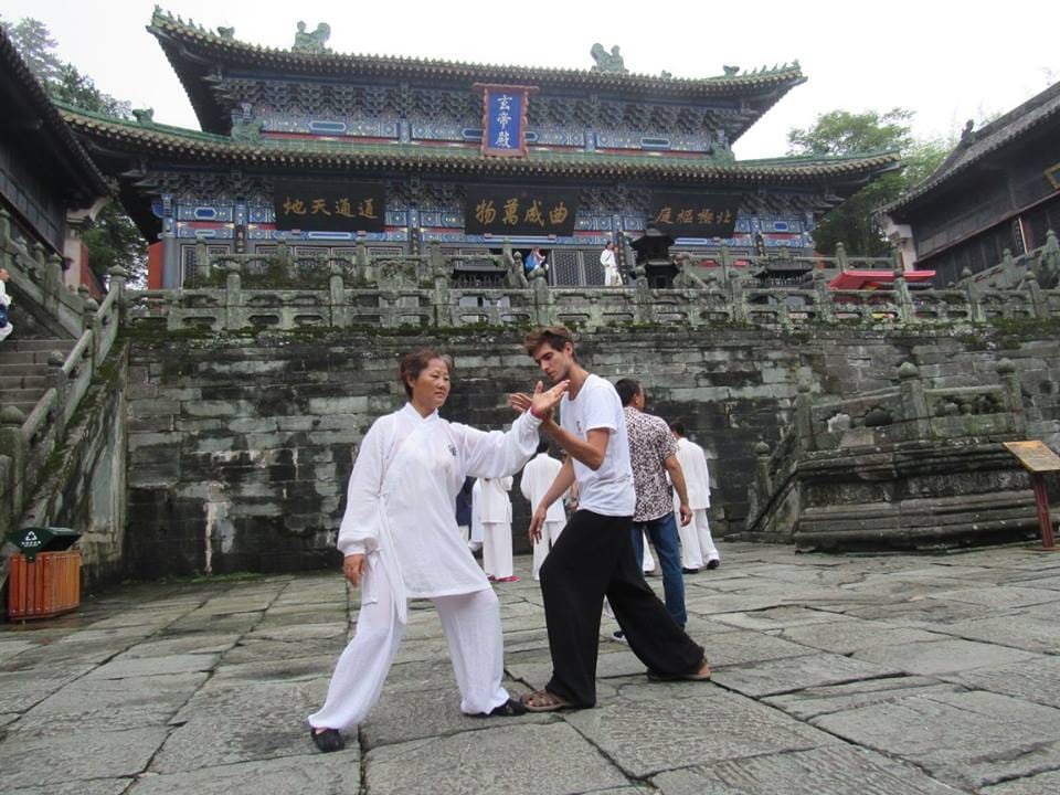 Chi Sao practice, a partner drill from Tai Chi, taking place in a Wudang Mountains Daoist Temple.