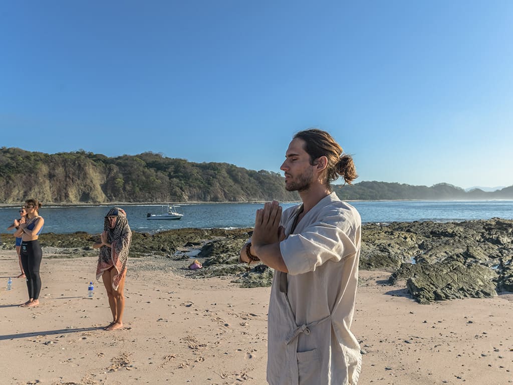 Morning meditation on Playa Cuarzo near Nosara Costa Rica