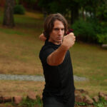 Bharu practicing Yi Jin Jing at a Shaolin Temple training in Europe, demonstrating the Muscle and Tendon Changing Classic Qigong form
